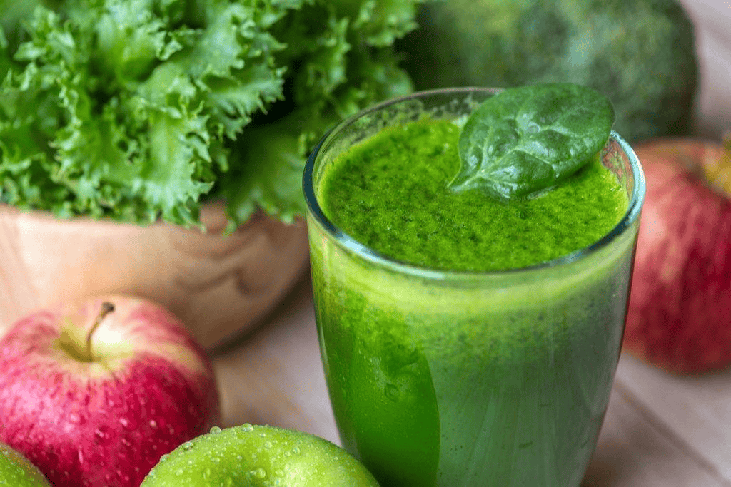 Fresh green detox smoothie beverage prepared with fresh fruits and leafy greens for Lebanese Village menu.