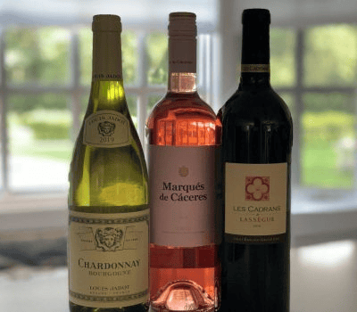 Premium wine selection featuring Louis Jadot Chardonnay, Marqués de Cáceres Rosé, and Les Cadrans de Lassègue red wine for Lebanese Village drink menu.