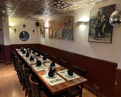 Lebanese Village restaurant dining room with long wooden table arrangements for private events and group bookings