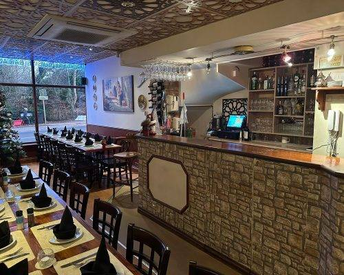 Lebanese Village restaurant interior showing bar service counter and spacious event dining setup
